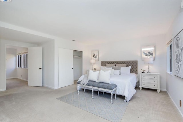 carpeted bedroom with a closet