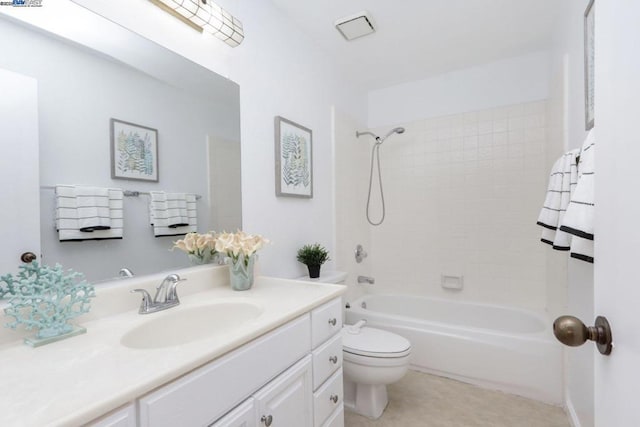 full bathroom featuring tub / shower combination, vanity, and toilet