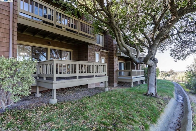 view of side of home featuring a lawn