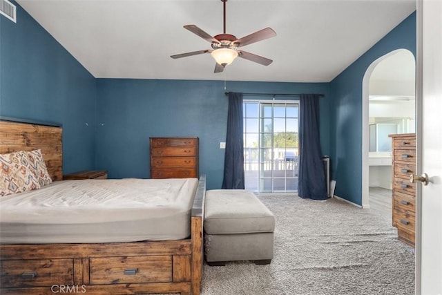 bedroom with access to outside, ceiling fan, and carpet