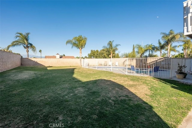 view of yard featuring a fenced in pool