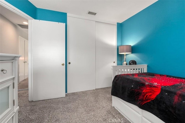 carpeted bedroom featuring a closet