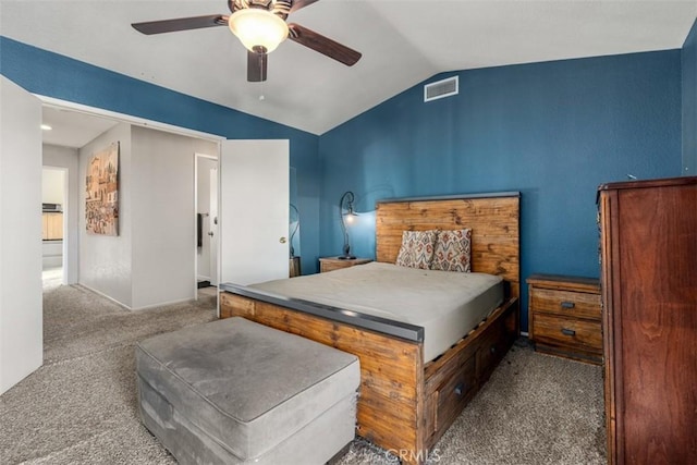 bedroom with ceiling fan, vaulted ceiling, and carpet