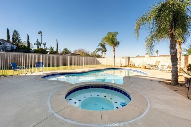 view of swimming pool featuring an in ground hot tub and a patio area