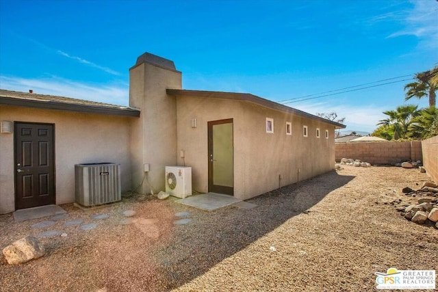 view of home's exterior featuring ac unit and central air condition unit