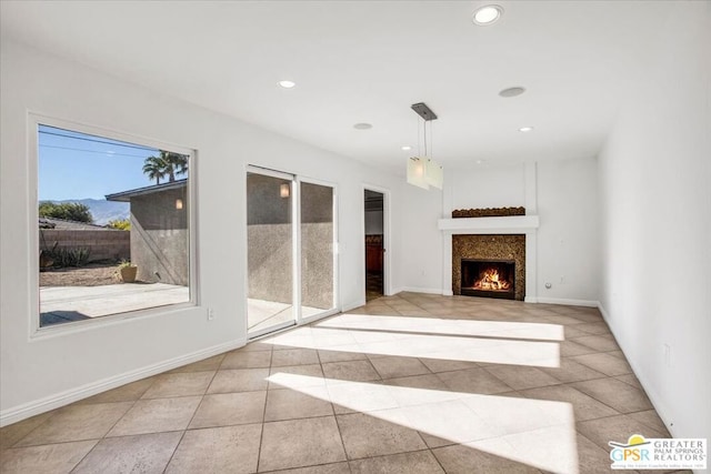 unfurnished living room with light tile patterned floors