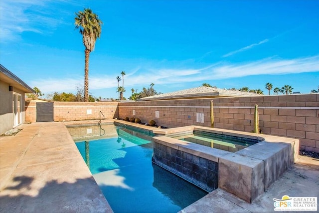 view of swimming pool featuring an in ground hot tub