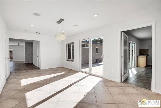 view of tiled spare room