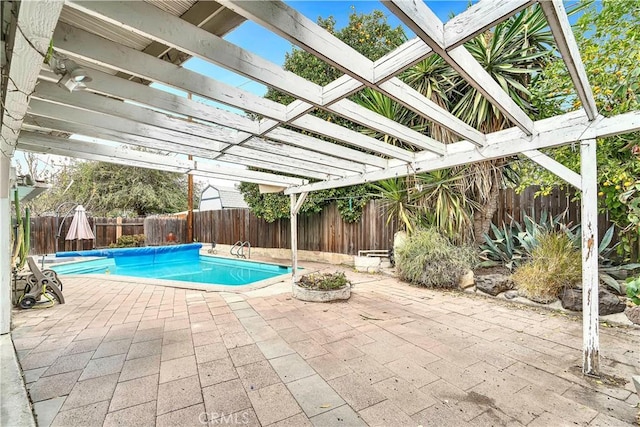 view of pool featuring a pergola and a patio