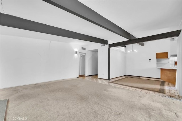 interior space featuring light colored carpet, a chandelier, and beamed ceiling