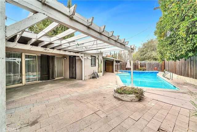 view of swimming pool with a pergola and a patio area