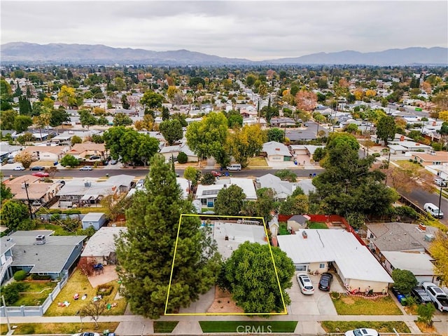 birds eye view of property featuring a mountain view