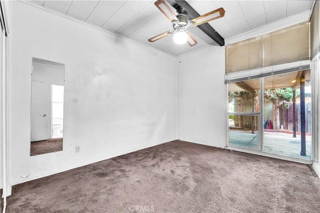 unfurnished room featuring ceiling fan, ornamental molding, carpet floors, and beamed ceiling