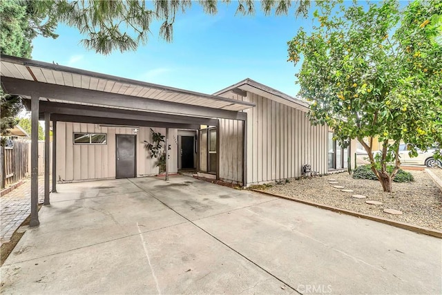 view of property exterior featuring a carport