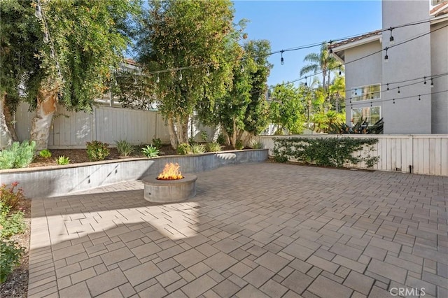 view of patio / terrace with a fire pit