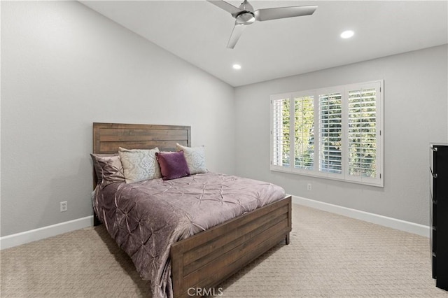 carpeted bedroom featuring ceiling fan and vaulted ceiling