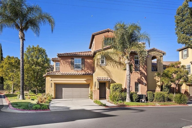 mediterranean / spanish-style home featuring a garage