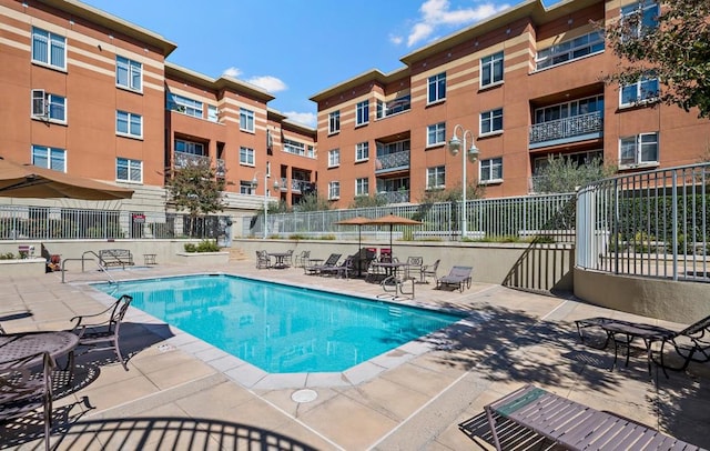 view of swimming pool with a patio