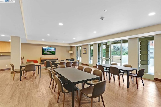 dining area with light wood-type flooring