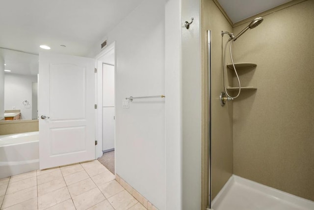 bathroom featuring independent shower and bath and tile patterned flooring