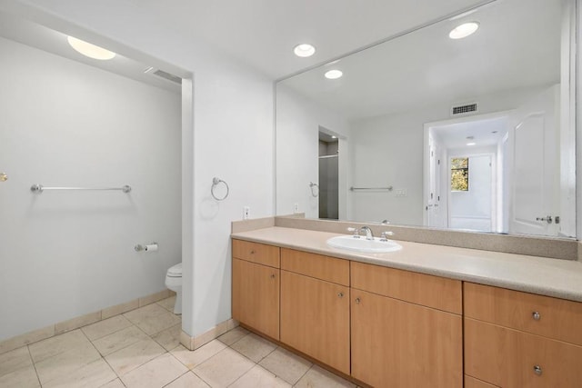 bathroom with toilet, an enclosed shower, vanity, and tile patterned floors