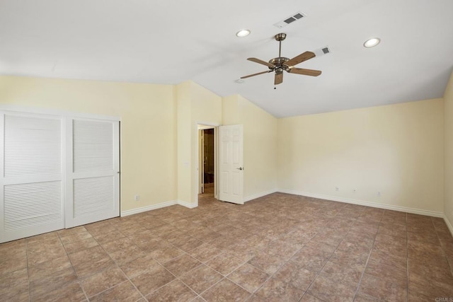 unfurnished bedroom with lofted ceiling and ceiling fan