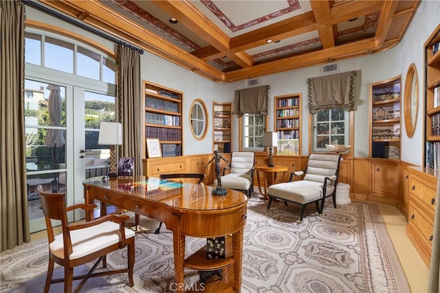 office area with beamed ceiling, french doors, ornamental molding, coffered ceiling, and a high ceiling