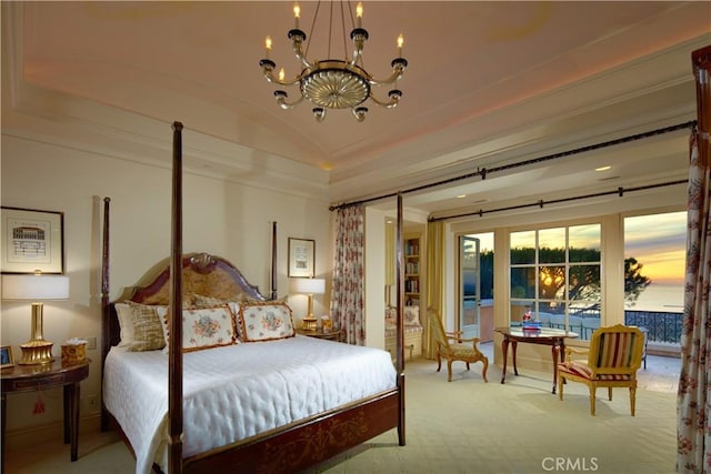 bedroom featuring an inviting chandelier, carpet floors, and lofted ceiling