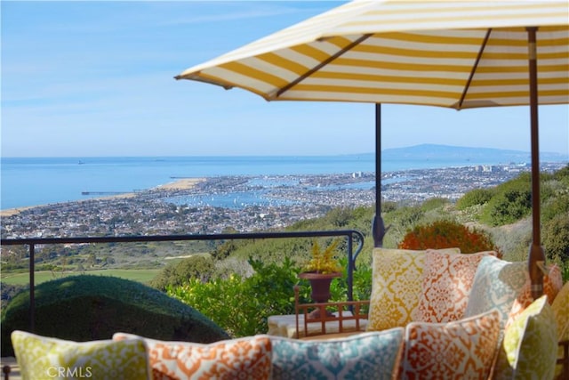 balcony featuring a water view