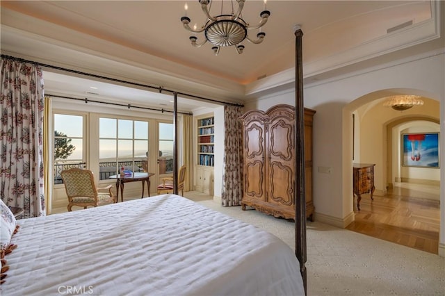 bedroom featuring a notable chandelier