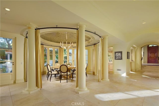 dining room with a wealth of natural light and a chandelier