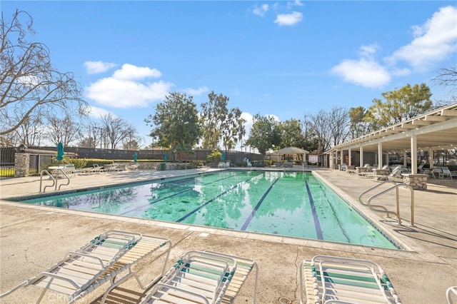 view of swimming pool with a patio