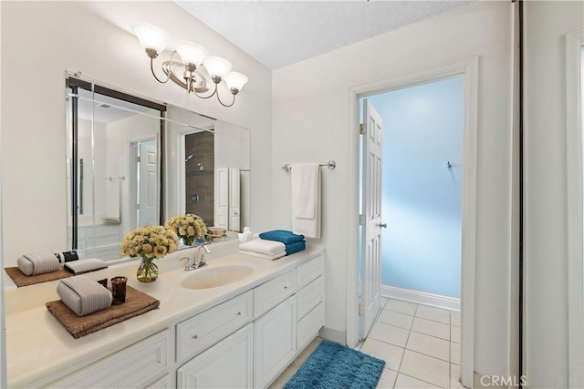 bathroom with vanity, walk in shower, and tile patterned floors