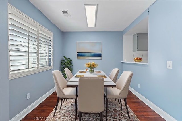 dining room featuring dark hardwood / wood-style flooring