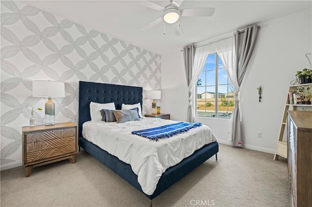 bedroom featuring ceiling fan and light carpet