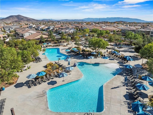 view of pool featuring a patio and a mountain view