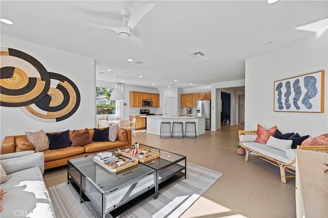 living room with ceiling fan