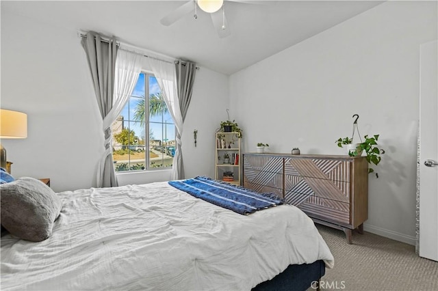 carpeted bedroom with lofted ceiling and ceiling fan