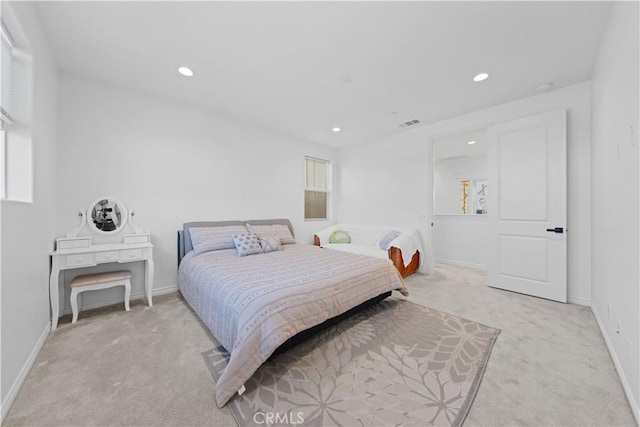 bedroom with light carpet