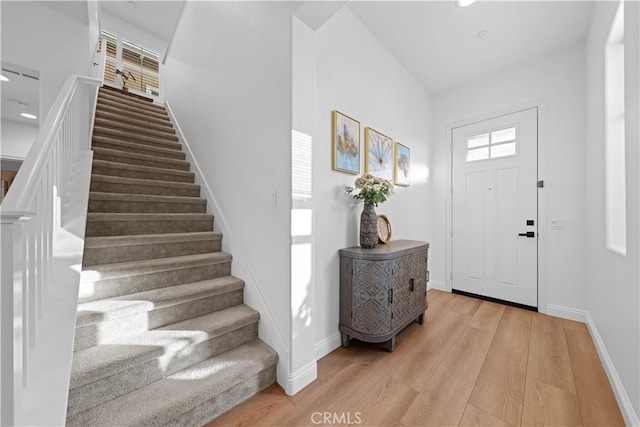 entryway with light hardwood / wood-style floors