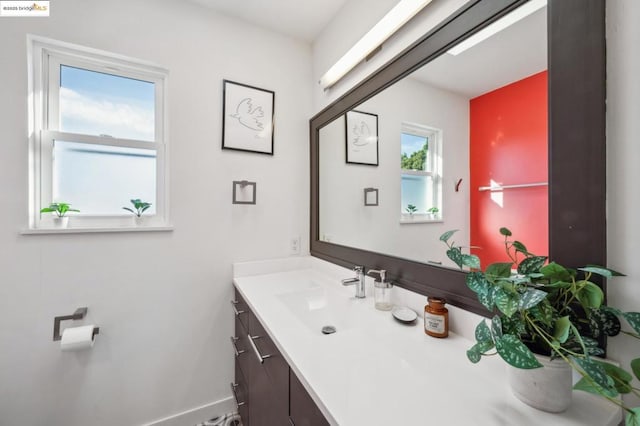 bathroom featuring a wealth of natural light and vanity