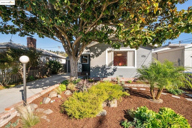 view of property hidden behind natural elements