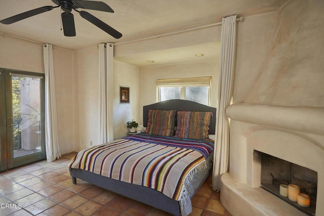 bedroom featuring ceiling fan, access to exterior, and tile patterned flooring