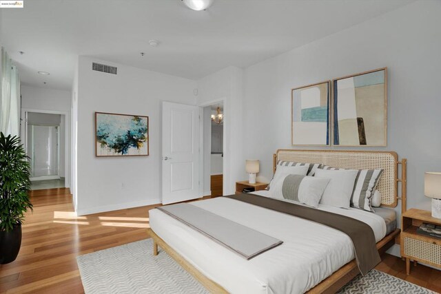 bedroom with light hardwood / wood-style flooring