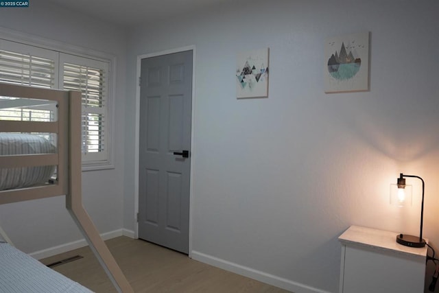 bedroom with light wood-type flooring