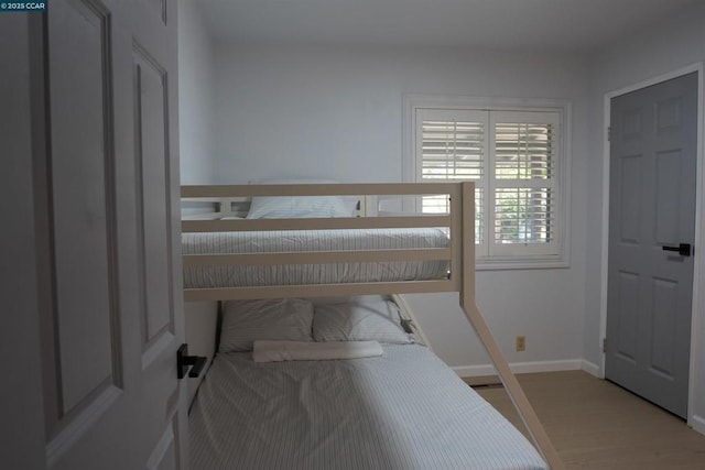 bedroom with light hardwood / wood-style flooring