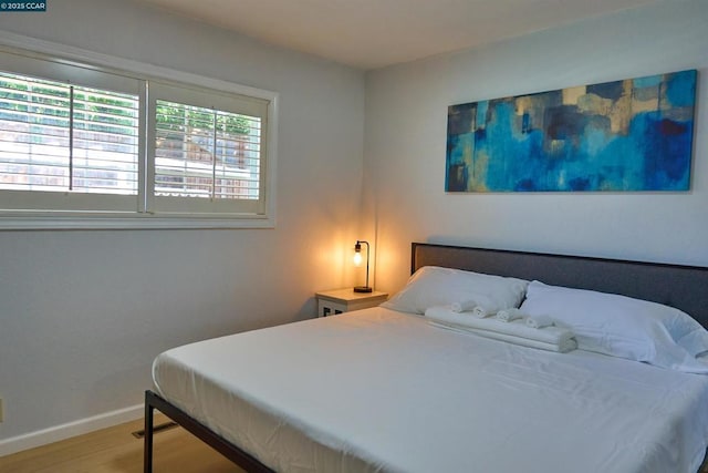 bedroom featuring hardwood / wood-style floors