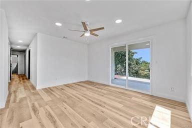 unfurnished room featuring ceiling fan and light wood-type flooring