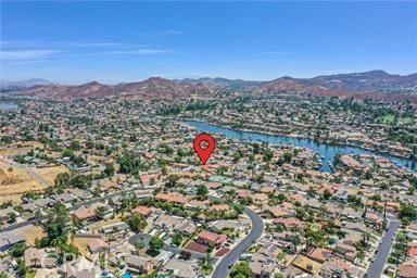 birds eye view of property featuring a water and mountain view