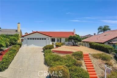 ranch-style home featuring a garage